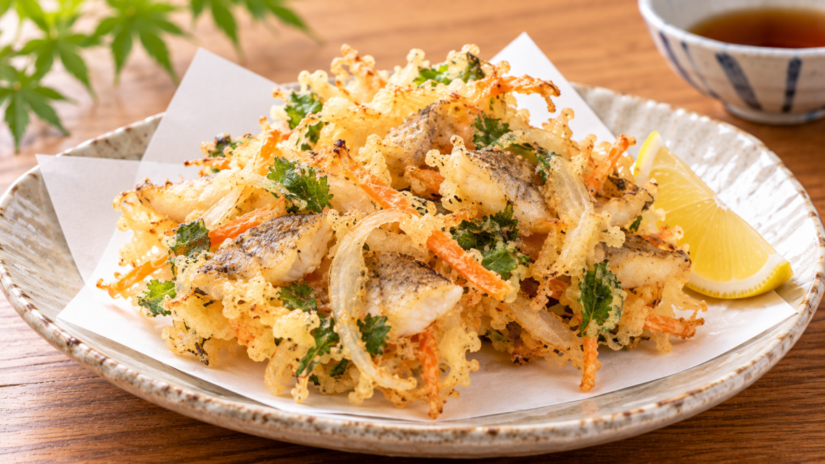 ハゼの白身と玉ねぎ、にんじん、青ねぎをまとめてサクッと揚げたかき揚げの料理写真